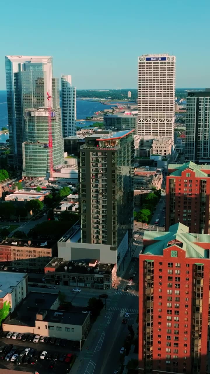 Downtown Milwaukee from above, with Ascent among the towers and the lakefront beyond.