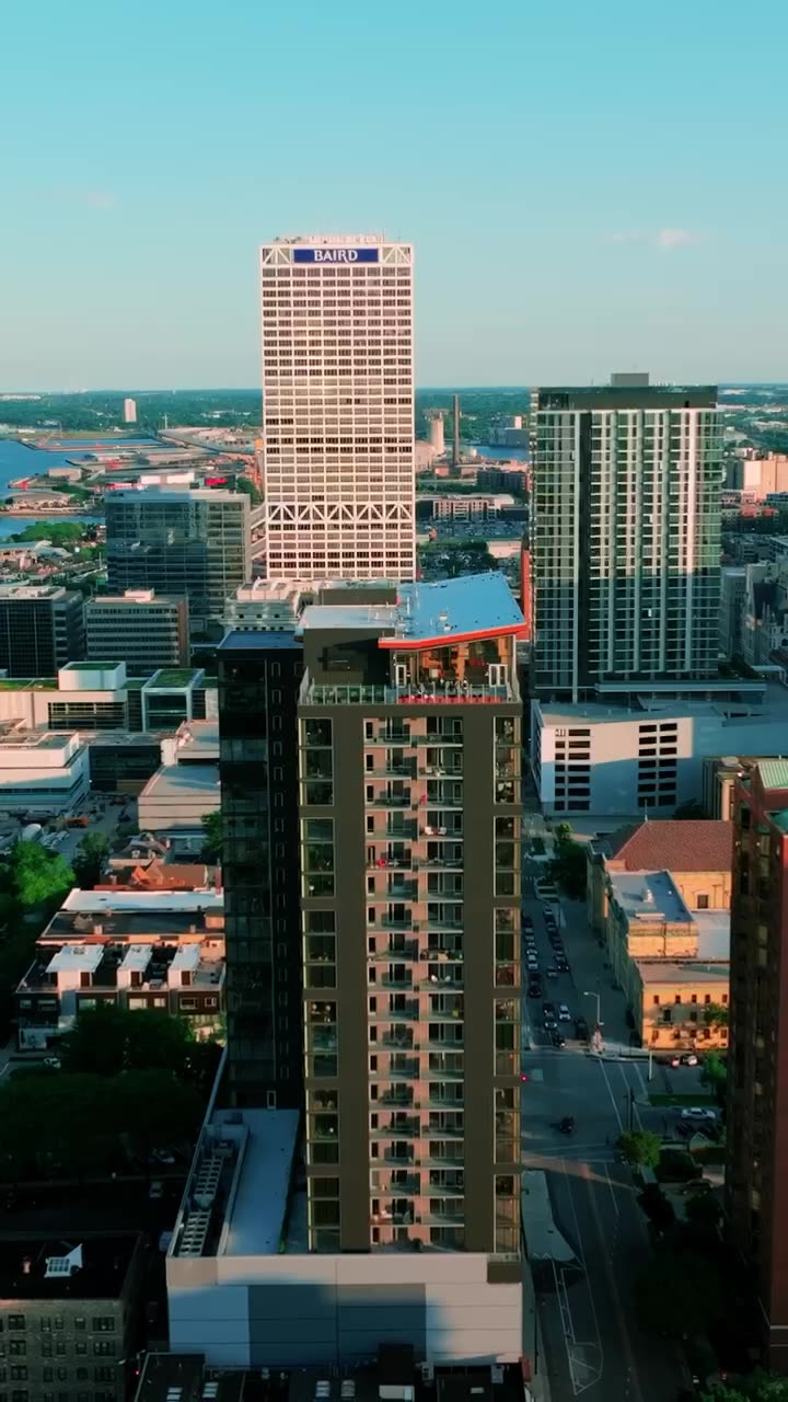Aerial view of the Ascent tower in downtown Milwaukee with Lake Michigan beyond.