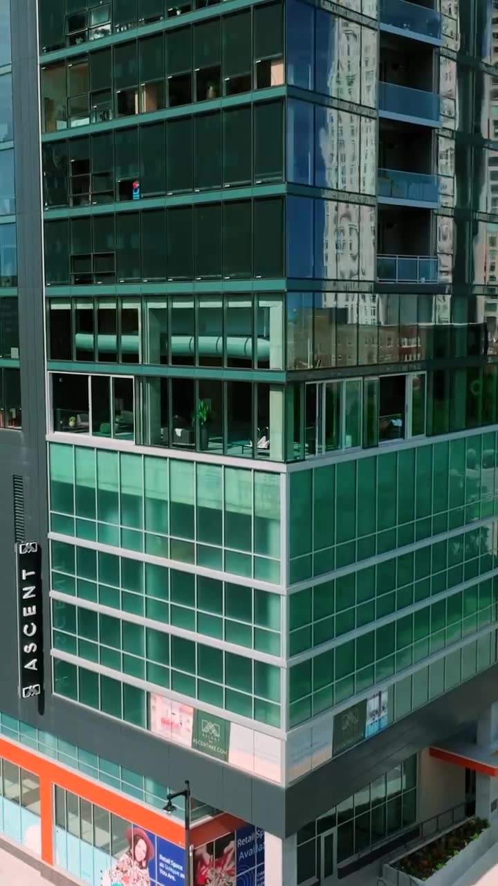 The Ascent tower's glass facade with its vertical ASCENT sign.
