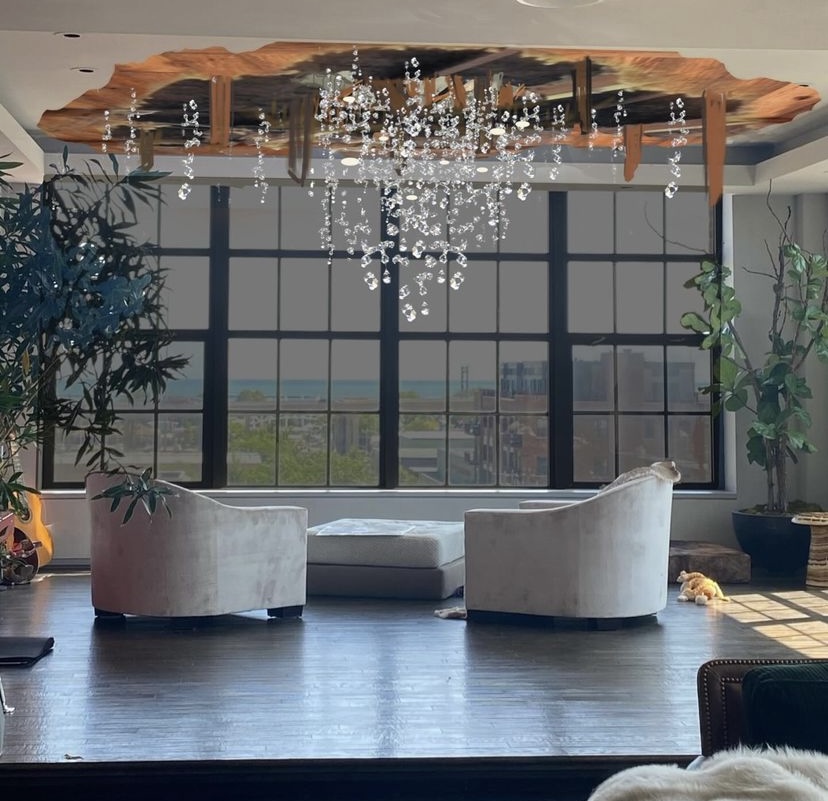 The original concept image: the loft with a torn opening of wood lath in the ceiling and strands of crystal falling from it, drawn over a photograph of the room.